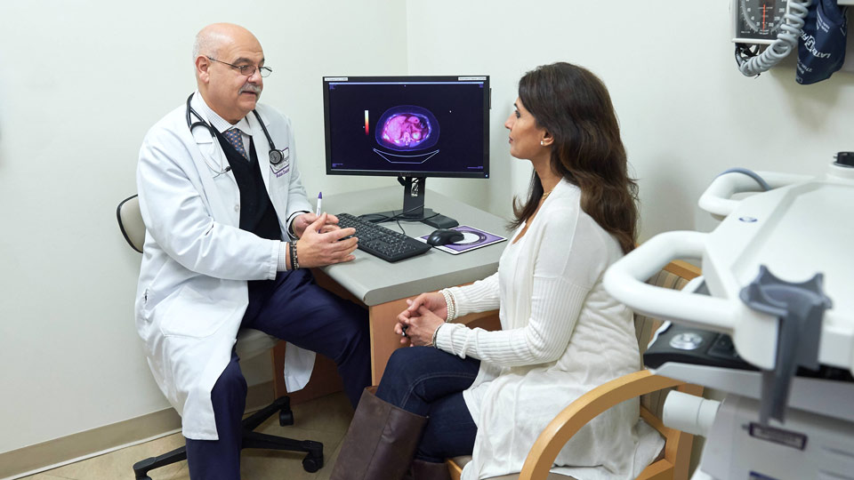 Dr. Abraham Chachoua with Patient