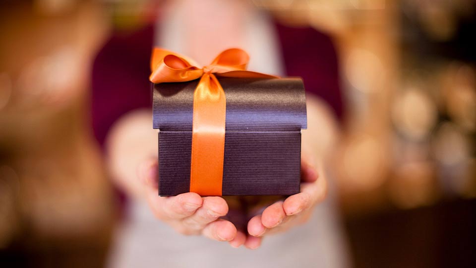 Woman Holding a Gift in Her Hands