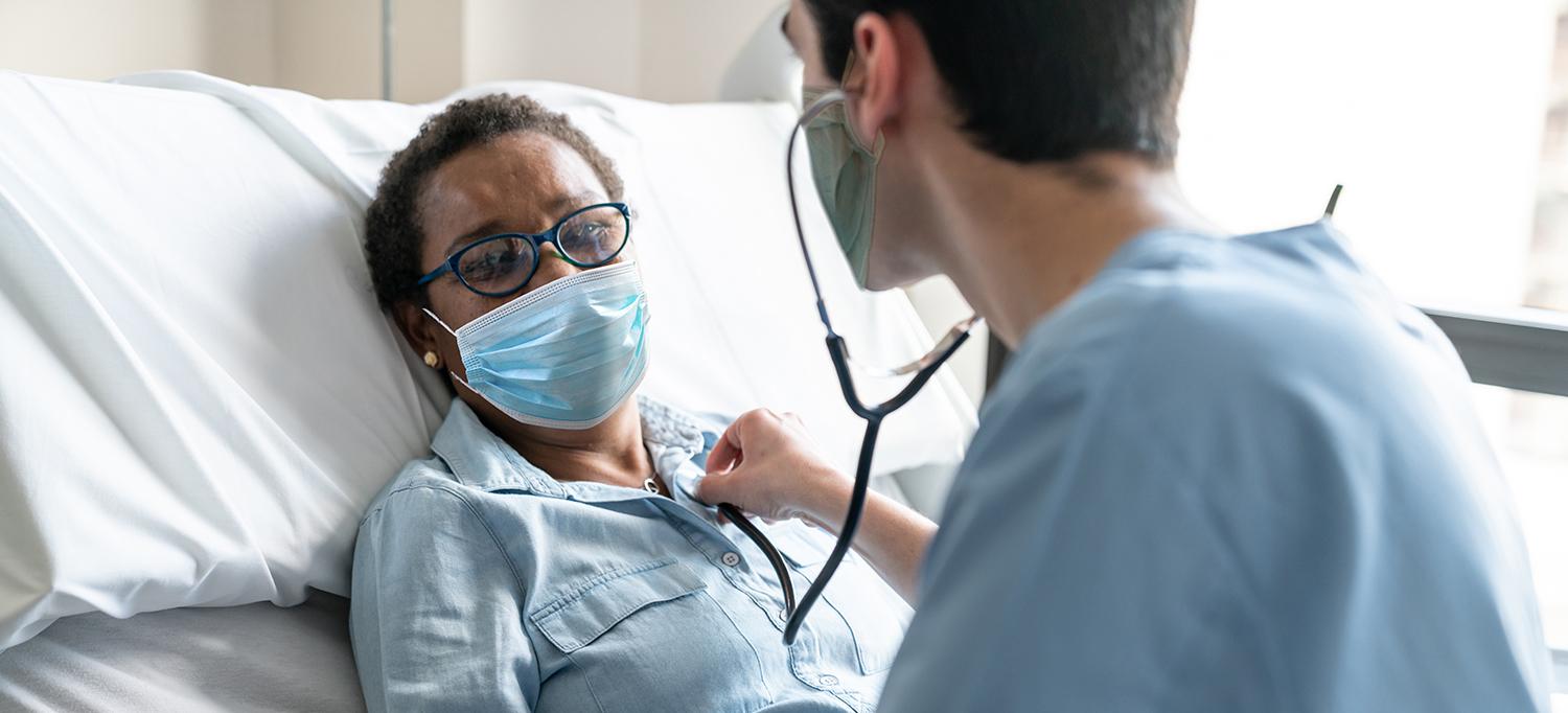 Doctor Checks Heartbeat of Patient