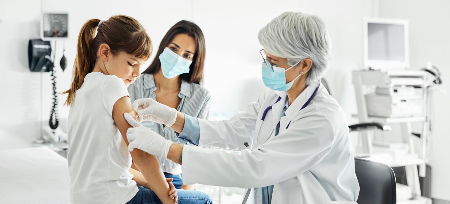 Healthcare Provider Puts Band-Aid on Child’s Arm