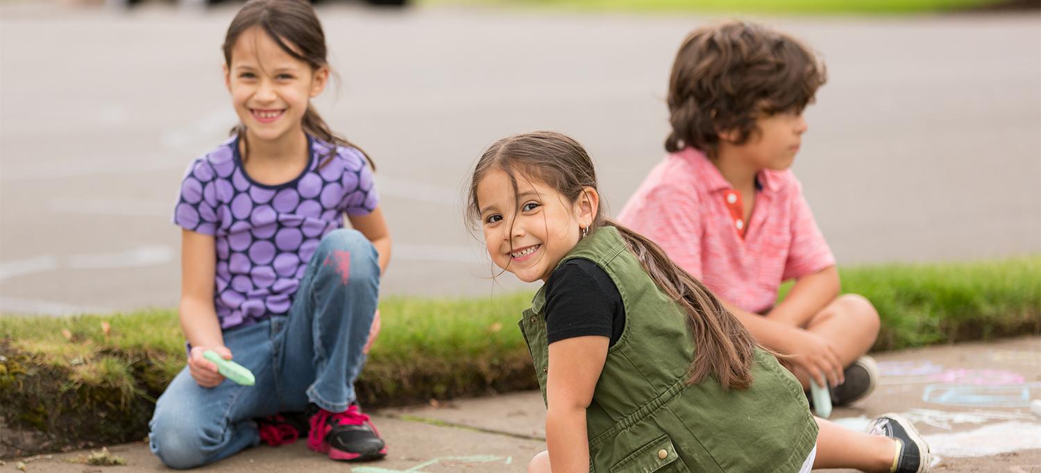 Children Playing with Sidewalk Chalk