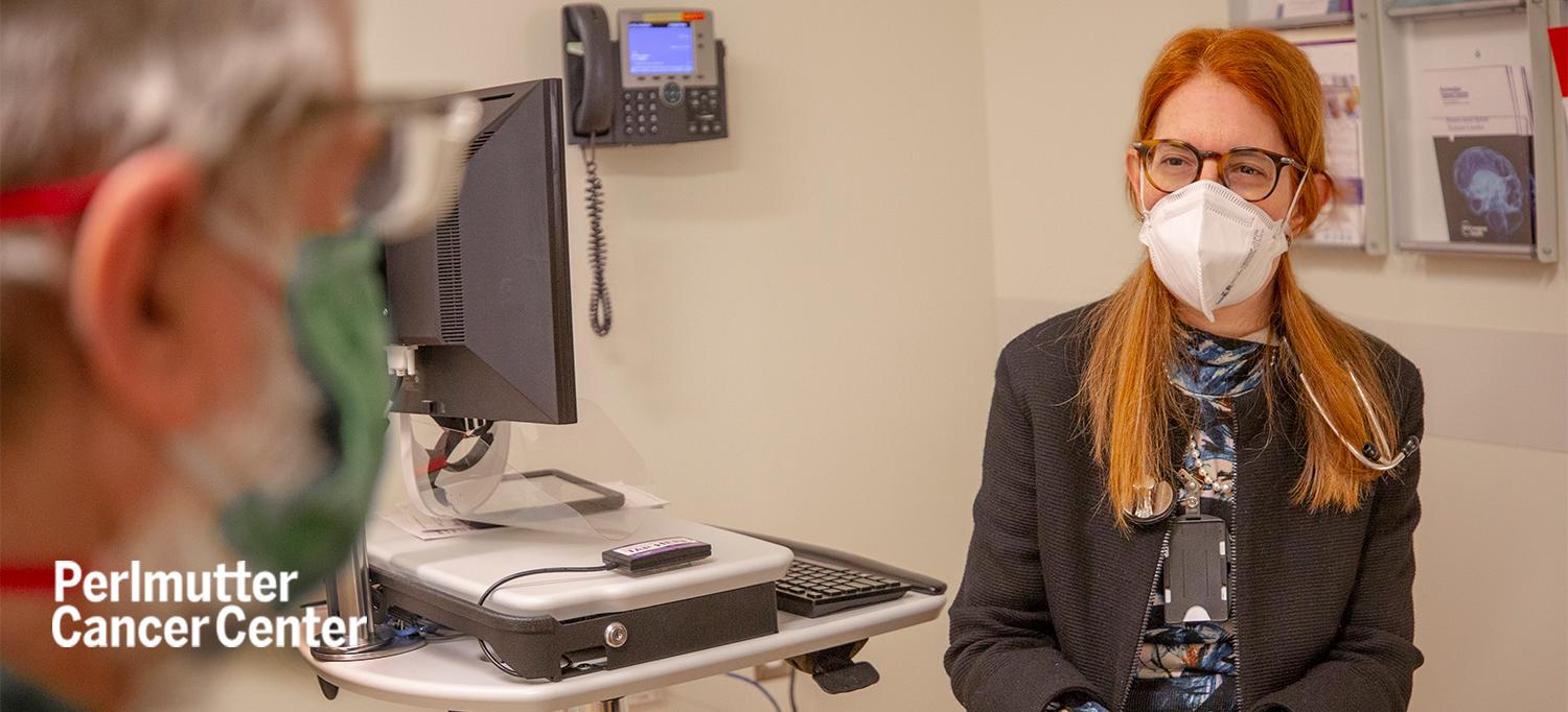 Dr. Catherine S. Diefenbach Speaks with Patient in Exam Room