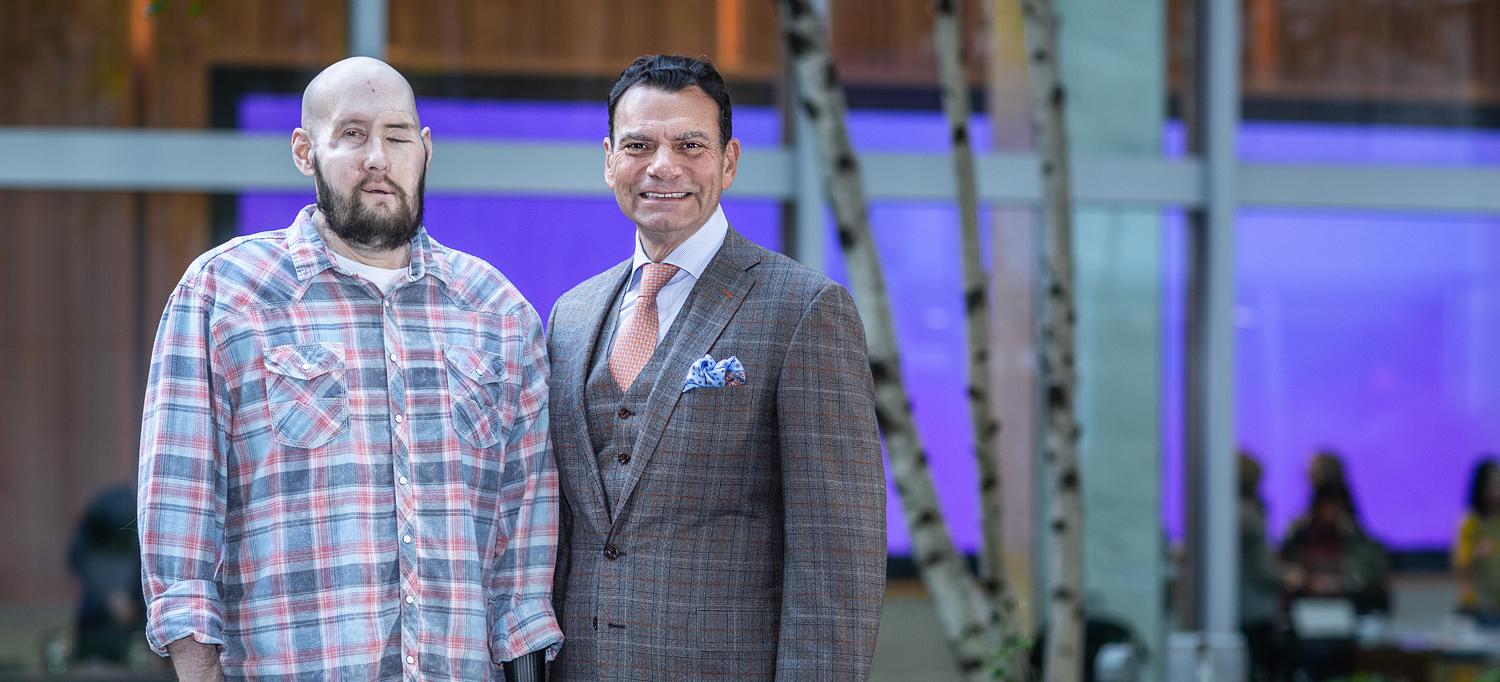 Aaron James and Eduardo D. Rodriguez standing next to each other in a courtyard