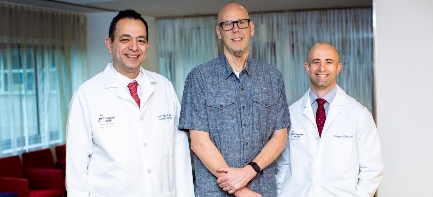 Ken Rich standing between Dr. Louai Razzouk and Dr. Gregory Katz
