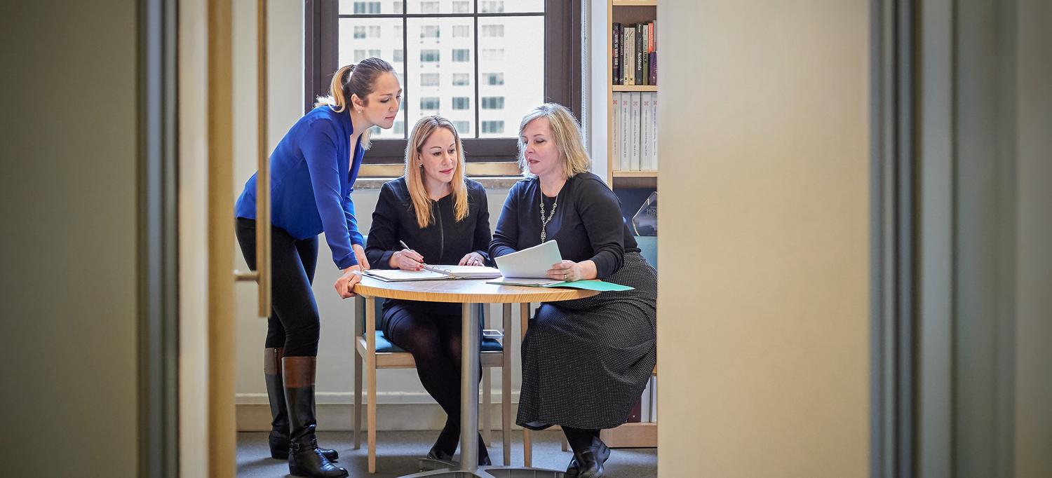 Dr. Loeb sits at a table next to two colleagues, Nataliya Byrne and Dawn Walter.