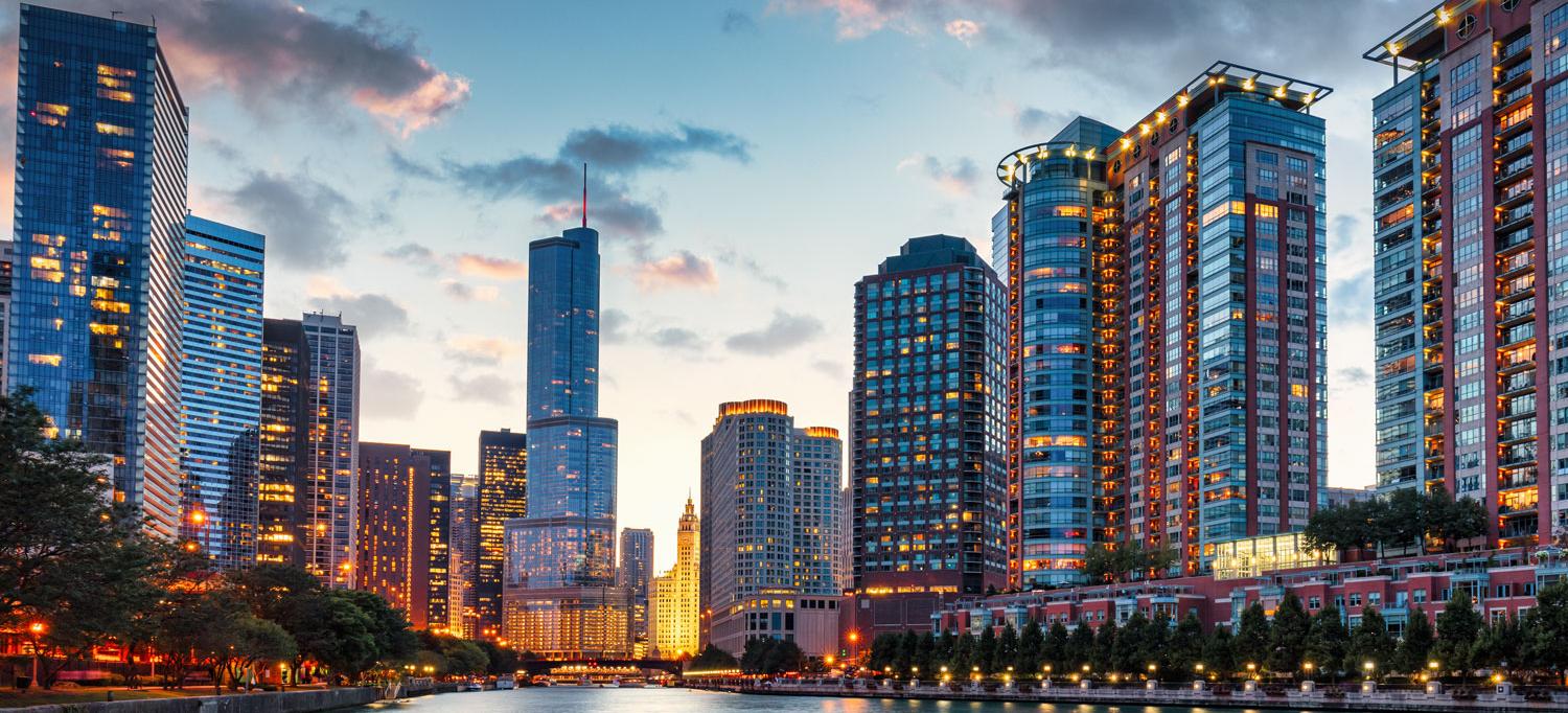 A view of the Chicago River and skyscrapers at sunset